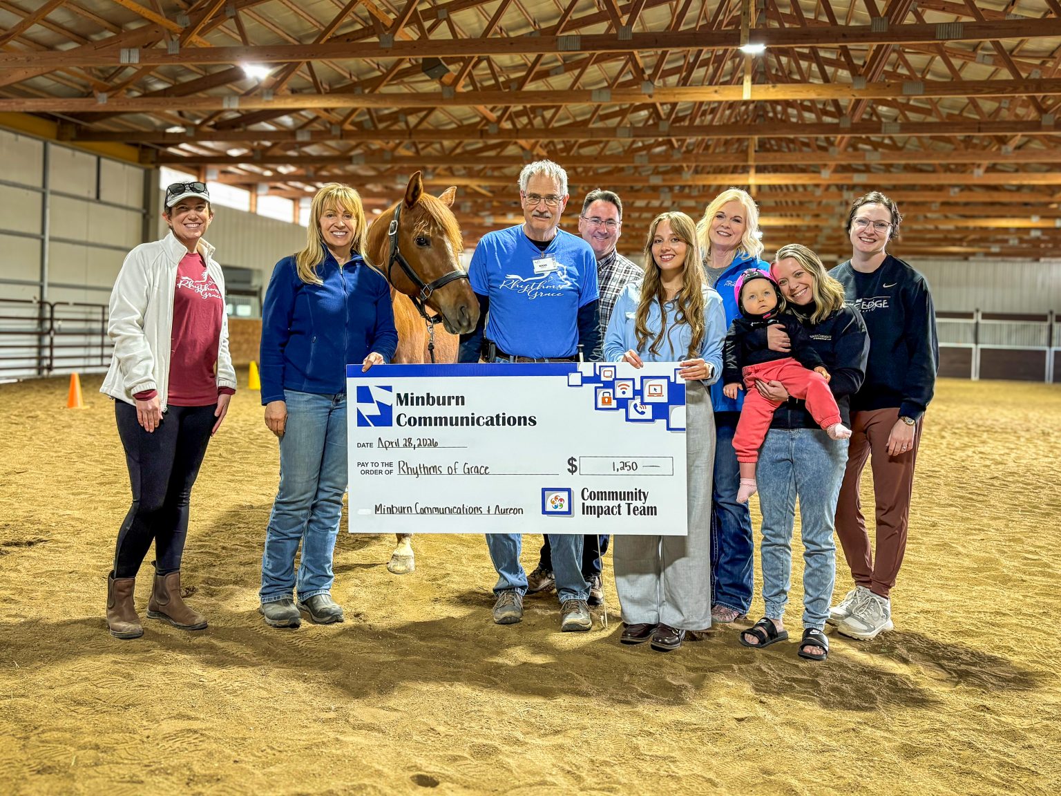 Group of people with a check